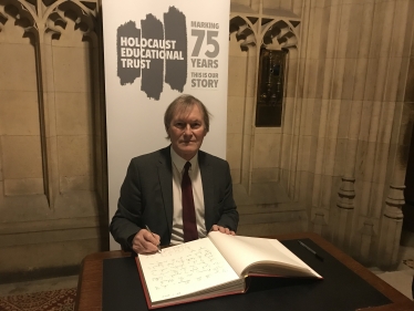 Sir David signs Holocaust Book of Commitment 